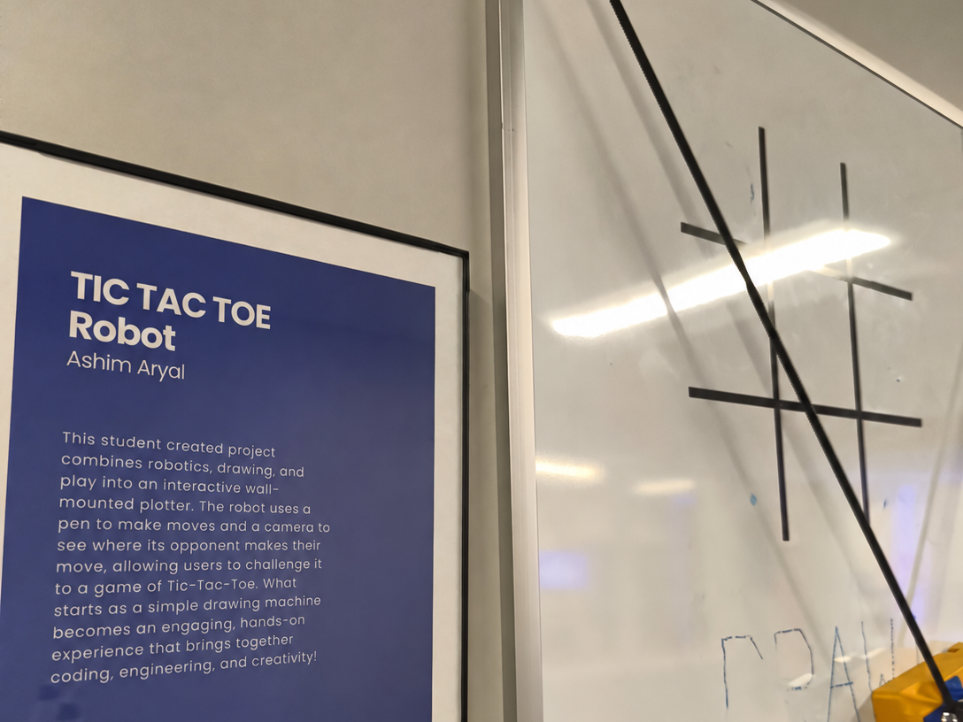 The wall plotter and camera playing tic-tac-toe on the wall